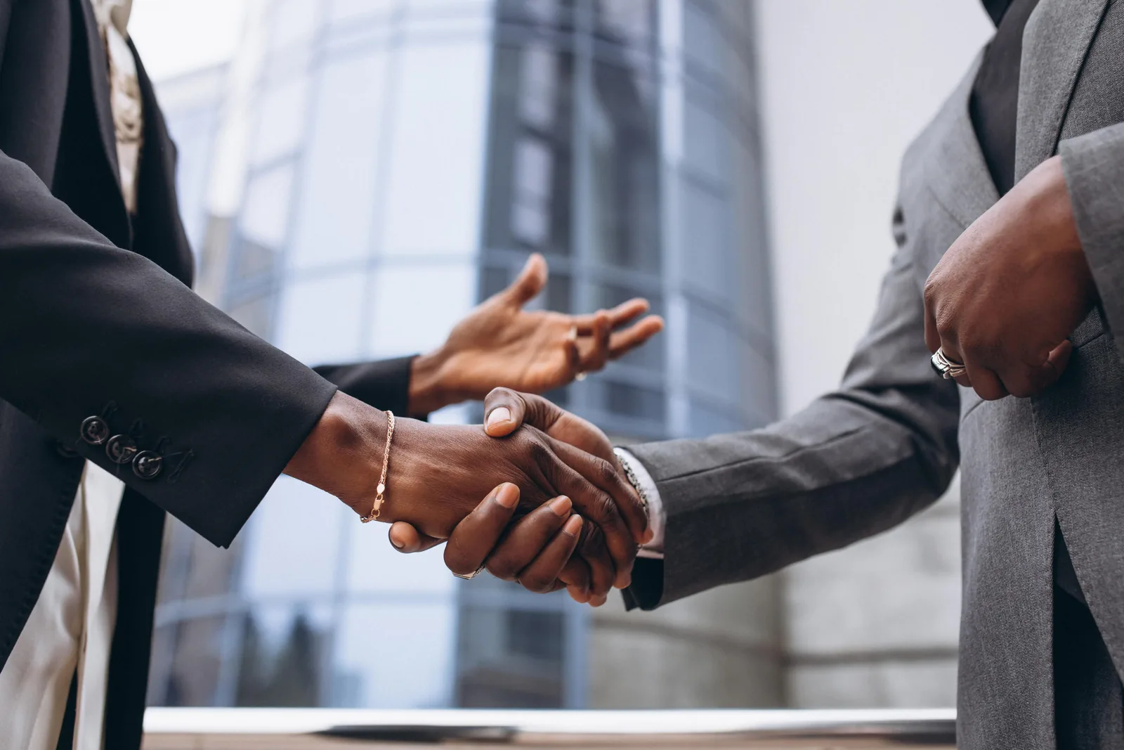 Advocates greeting a client outside the office
